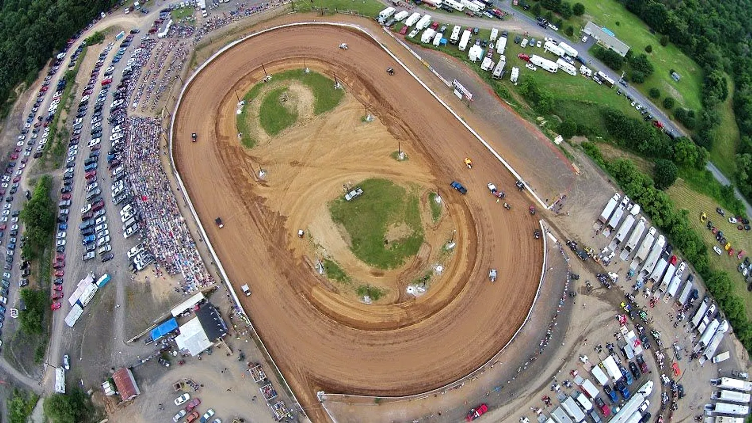 Aerial view of Path Valley Speedway packed with cars and fans on race night