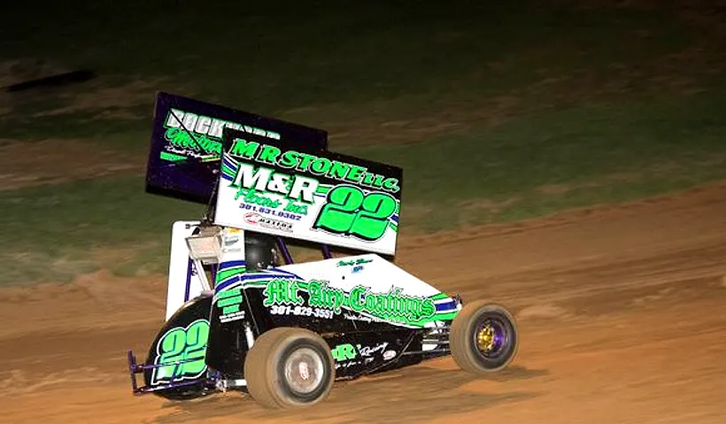 Sprint cars racing under the lights